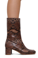 Terry de Havilland Lola Sand boots with pointed toes and chunky heels, showcasing beige suede material and stylish design.
