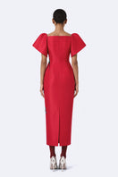 Red The Flare Orchid midi dress by Tiny Ink, showcasing its flowing fabric and stylish design perfect for elegant occasions.