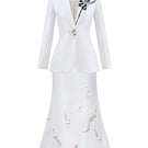 White co-ord set featuring Tiny Ink's Shadow Iris blazer and midi skirt, shown on a model with a stylish, modern look.