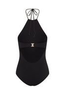Black Talia Collins Christy swimsuit displayed on a model, featuring a sleek design and adjustable straps.