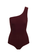 Reversible terry swimsuit by Talia Collins featuring an asymmetrical design, shown from the front with bold color blocking and smooth fabric.
