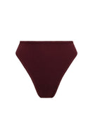 Reversible high-waisted bikini top and high-cut briefs in terry fabric by Talia Collins, shown from the front.