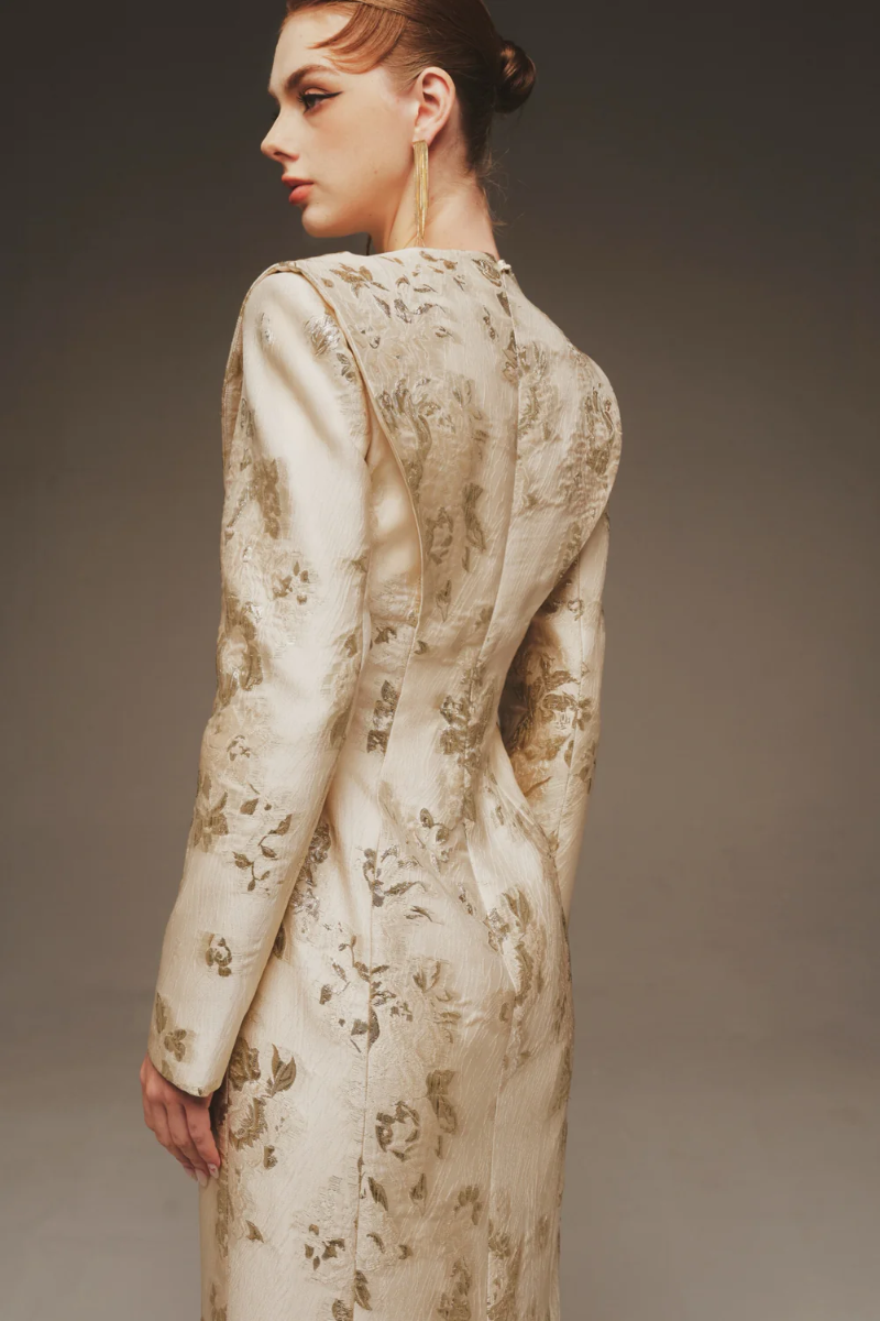 Elegant maxi dress by Margée Atelier featuring a sculptural rose design, flowing fabric, and a sophisticated, ethereal silhouette.