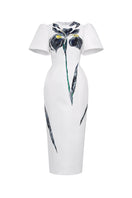 White Tiny Ink The Inner Flame Iris midi dress displayed on a hanger with flowing fabric and elegant design.
