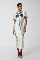 White Tiny Ink Inner Flame Iris midi dress displayed on a mannequin, showcasing its elegant design and flowy fabric.