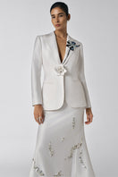 White The Shadow Iris blazer and midi skirt co-ords by Tiny Ink, styled together on a hanger. Elegant and modern fashion ensemble.