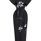 Black Tiny Ink Twist Orchid Midi Dress displayed on a mannequin with a fitted waist and elegant neckline.