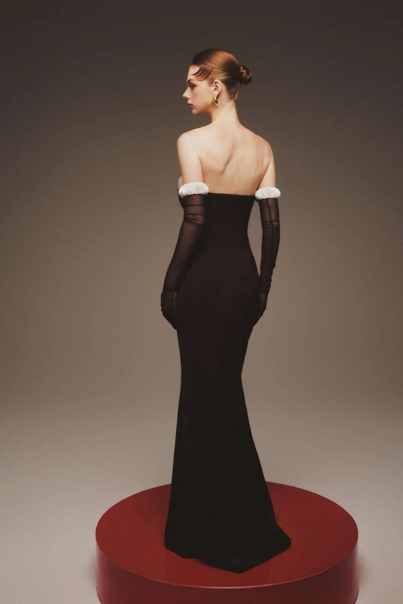 Elegant black maxi dress by Margée Atelier, The Vesper Evening Gown, featuring flowing fabric and sophisticated design.