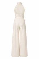 Sand-colored ANA + MARIA wrapped jumpsuit displayed on a ghost mannequin, showcasing its stylish and comfortable design.