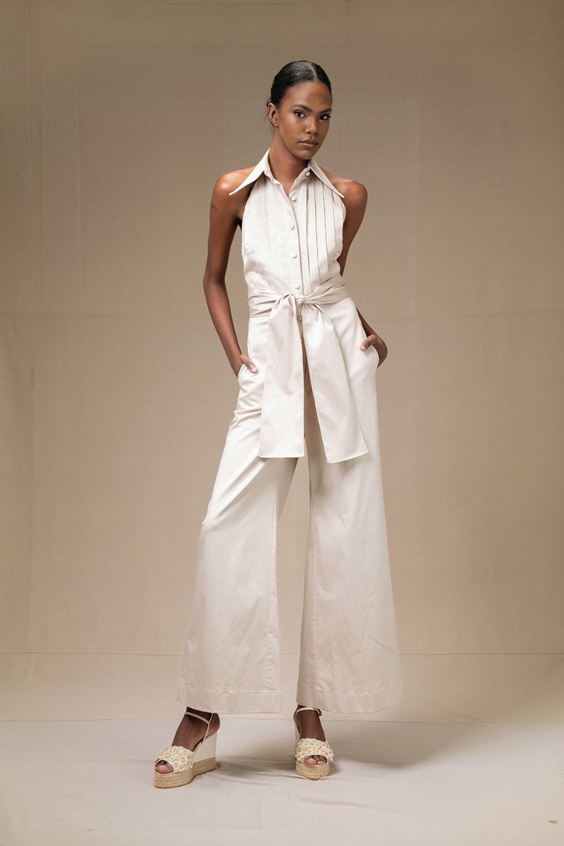 ANA + MARIA wrapped jumpsuit in sand, featuring a stylish design with a cinched waist and relaxed fit, perfect for casual wear.