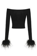 Nana Jacqueline Thea Black top shown from the back, featuring a sleek, fitted design with a smooth fabric finish.
