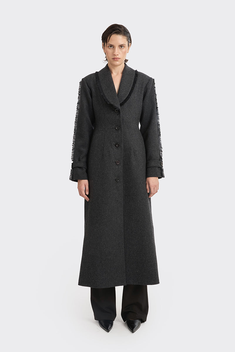 Black Thread Coat by Stolen Stores, stylish outerwear with a sleek design, shown on a hanger against a plain background.