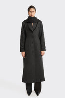 Black Thread Coat by Stolen Stores, a stylish outerwear piece with a sleek design and detailed stitching.