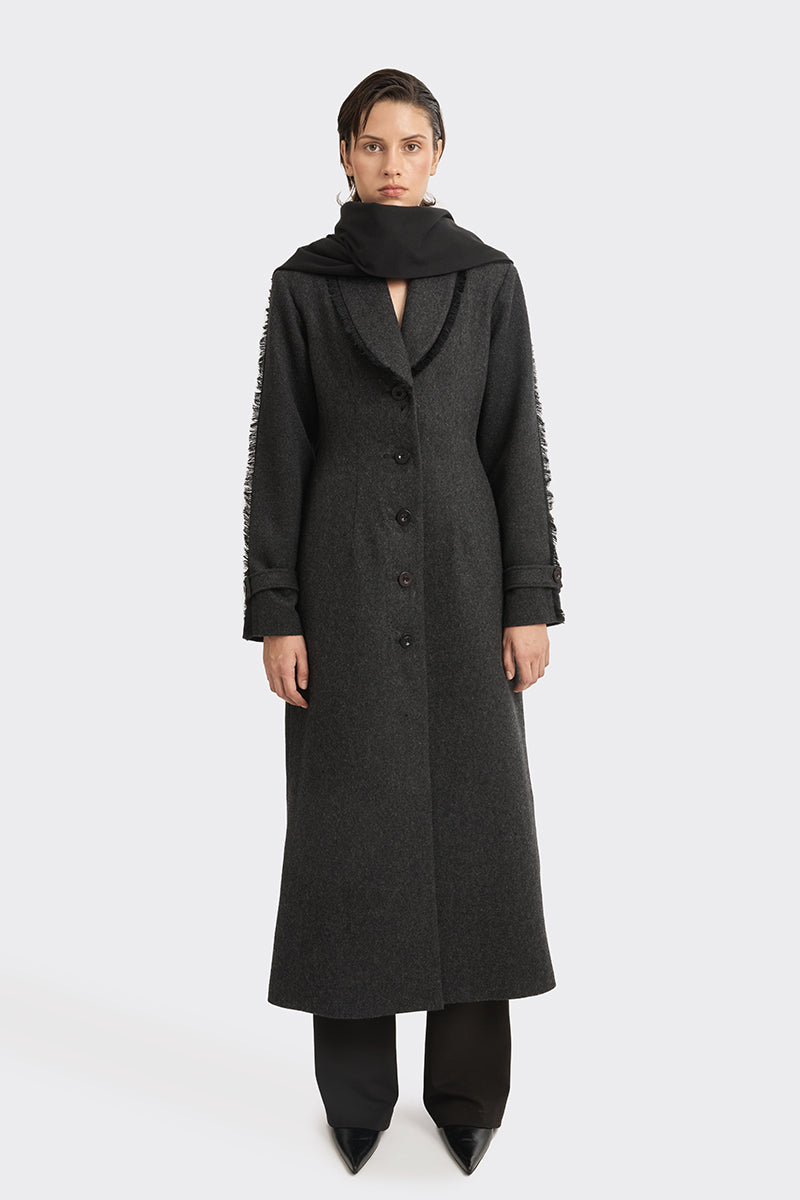 Black Thread Coat by Stolen Stores, a stylish outerwear piece with a sleek design and detailed stitching.