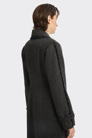 Black thread coat by Stolen Stores featuring a sleek design and stylish details, perfect for a modern outerwear look.