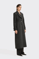 Black Thread Coat by Stolen Stores featuring a sleek design and stylish stitching, perfect for a modern, minimalist look.