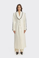 Off-white thread coat by Stolen Stores, stylish long coat with visible stitching details and a tailored fit.