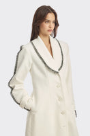 Off-white thread coat by Stolen Stores, stylish long outerwear with textured fabric and modern design, perfect for fall and winter wear.