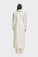 Off-white Thread coat by Stolen Stores, stylish outerwear with a tailored fit and clean design, shown in a front view.