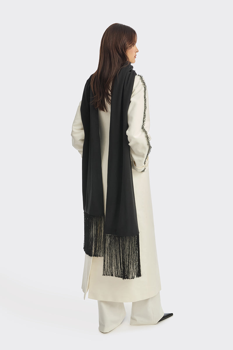 Off-white thread coat by Stolen Stores, stylish outerwear with detailed stitching and a modern design, shown on a model.