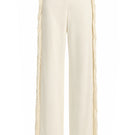 Ivory white thread fringe maxi pants from Stolen Stores, featuring flowing fabric and detailed fringe design.