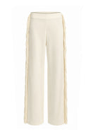 Ivory white thread fringe maxi pants from Stolen Stores, featuring flowing fabric and detailed fringe design.