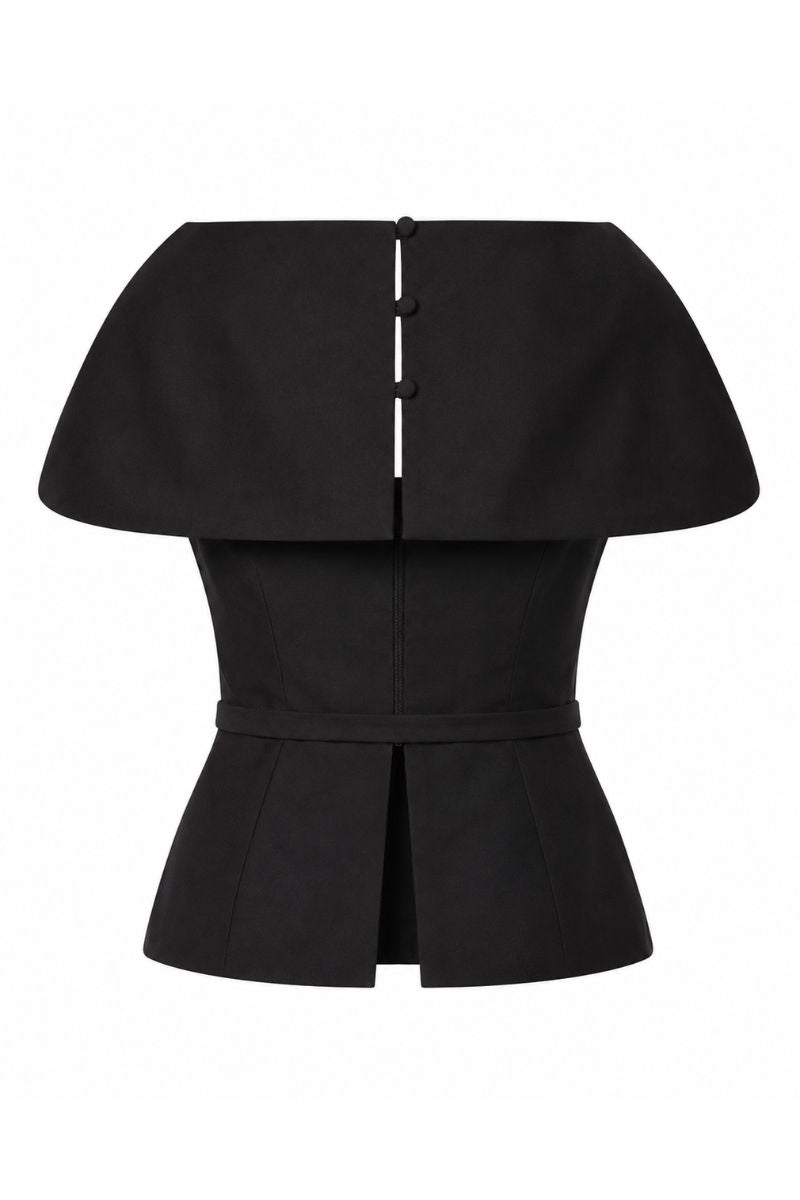 Black Tibet top from ANA + MARIA displayed on a ghost mannequin, showcasing its stylish sleeveless design and fitted silhouette.