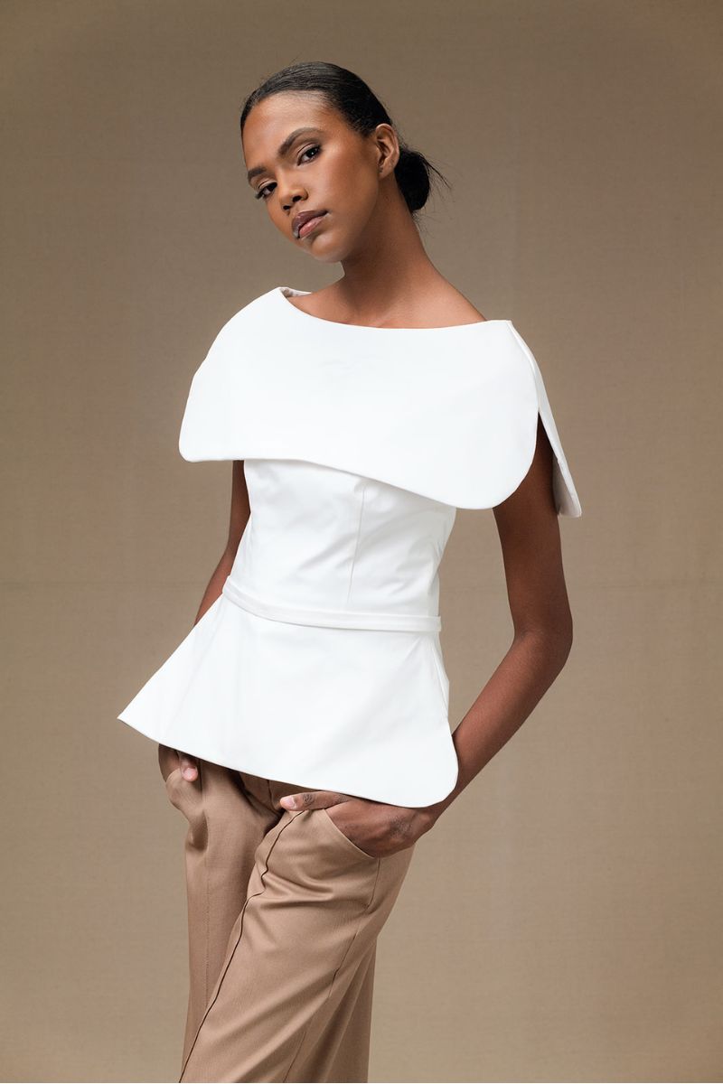 Ivory Tibet Top by ANA + MARIA, a stylish women's blouse with a relaxed fit and elegant design.