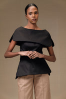Black Tibet top by ANA + MARIA, featuring a stylish, fitted design with a round neckline and long sleeves.