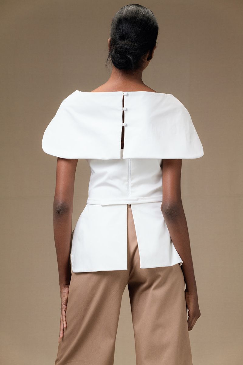 Ivory Tibet Top by ANA + MARIA, featuring a stylish design with a relaxed fit and soft fabric, perfect for casual wear.