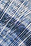 Close-up of SemSem tie-dyed plissé lamé turtleneck top showing textured fabric and vibrant color details.