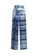 SemSem tie-dyed plissé lamé wide-leg pants shown flat, featuring vibrant tie-dye pattern and shimmering lamé fabric.
