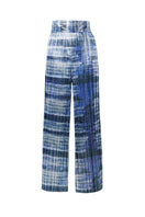 Tie-dyed plissé lamé wide-leg pants by SemSem shown flat front, featuring colorful tie-dye pattern and flowing, wide-leg design.