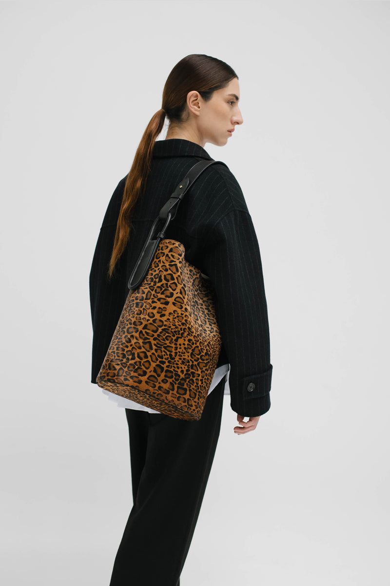 ISIDORA MALVA Tierralta Leopard Tote shoulder bag with animal print and top handles, stylish and spacious for everyday use.