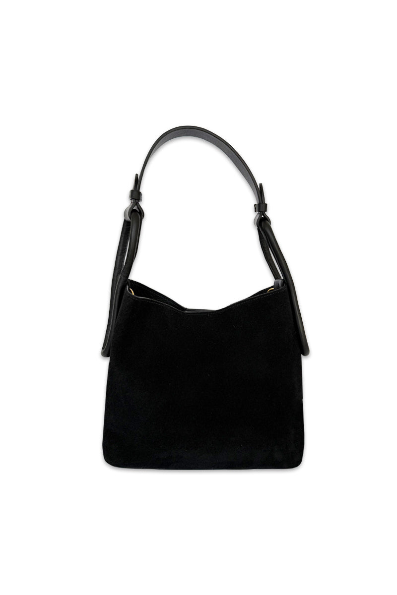 Black suede TIERRANUEVA tote bag with top handle by ISIDORA MALVA, featuring a sleek, minimalist design and structured silhouette.