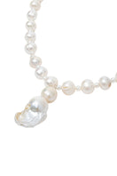 Elegant pearl baroque necklace by Oz Objects featuring intricate, timeless design with lustrous irregular pearls.