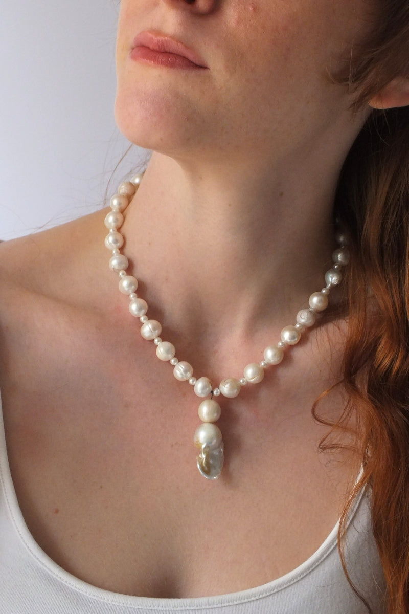 Elegant pearl baroque necklace by Oz Objects featuring intricate, timeless design and lustrous pearl details.