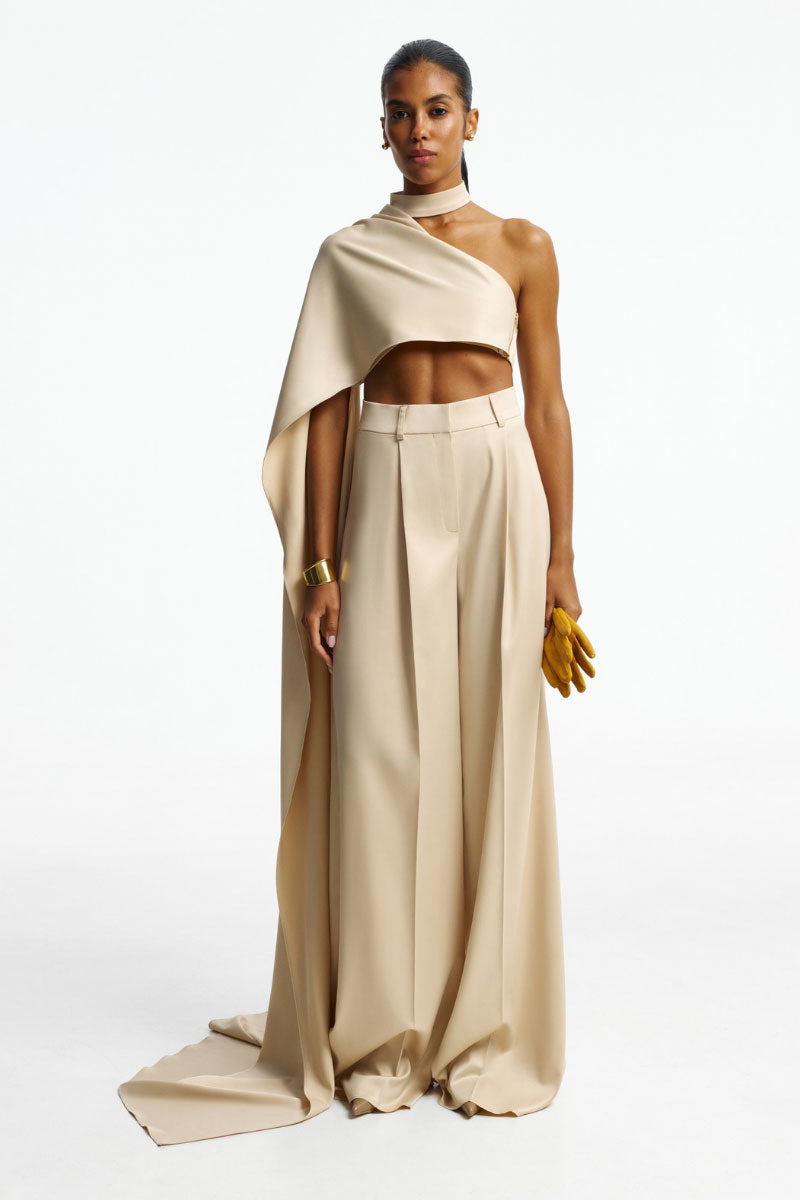 Beige one-shoulder asymmetric top by Santa Brands, stylish women's tops with unique draped design and elegant fit.