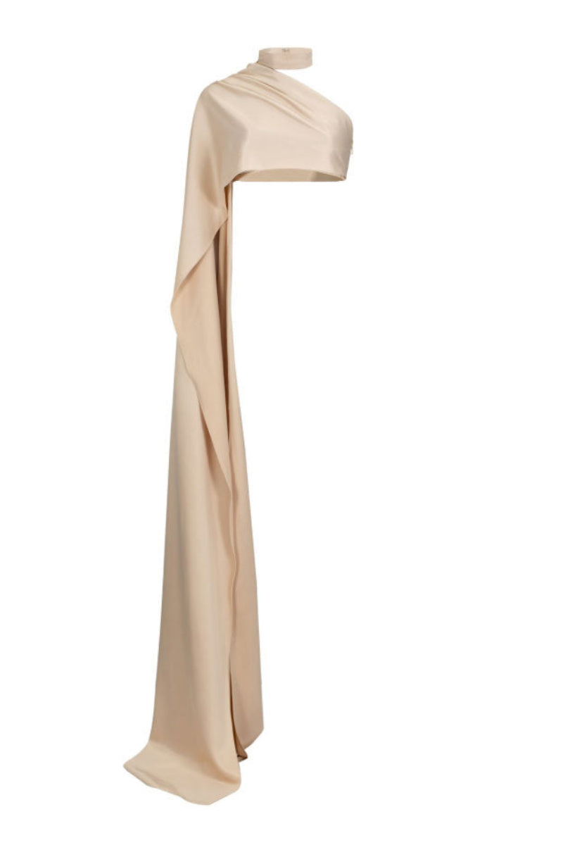 Beige one-shoulder asymmetrical top by Santa Brands, showcasing its stylish design and draped fabric on a model.