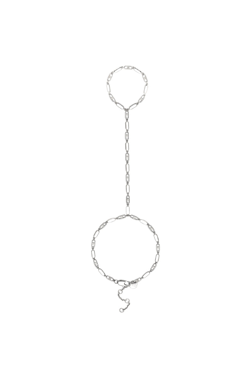 Silver hand chain by Velvet Desert featuring intricate design, worn on the hand for a stylish jewelry accessory.