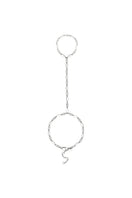 Silver hand chain bracelet from Velvet Desert's Toulouse collection featuring intricate silver design on a model's hand.