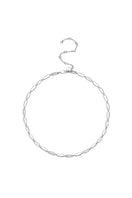 Silver Toulouse necklace by Velvet Desert featuring a delicate chain and elegant pendant lying flat on a neutral background.