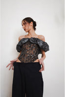 Black YASSMIN SALEH Trace corset top with structured front and fitted design, displayed from the front view.