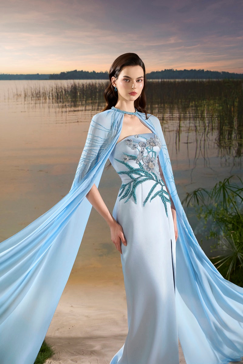 Blue chiffon maxi dress with cape by Tracy Studio, flowing fabric and elegant design for formal occasions.