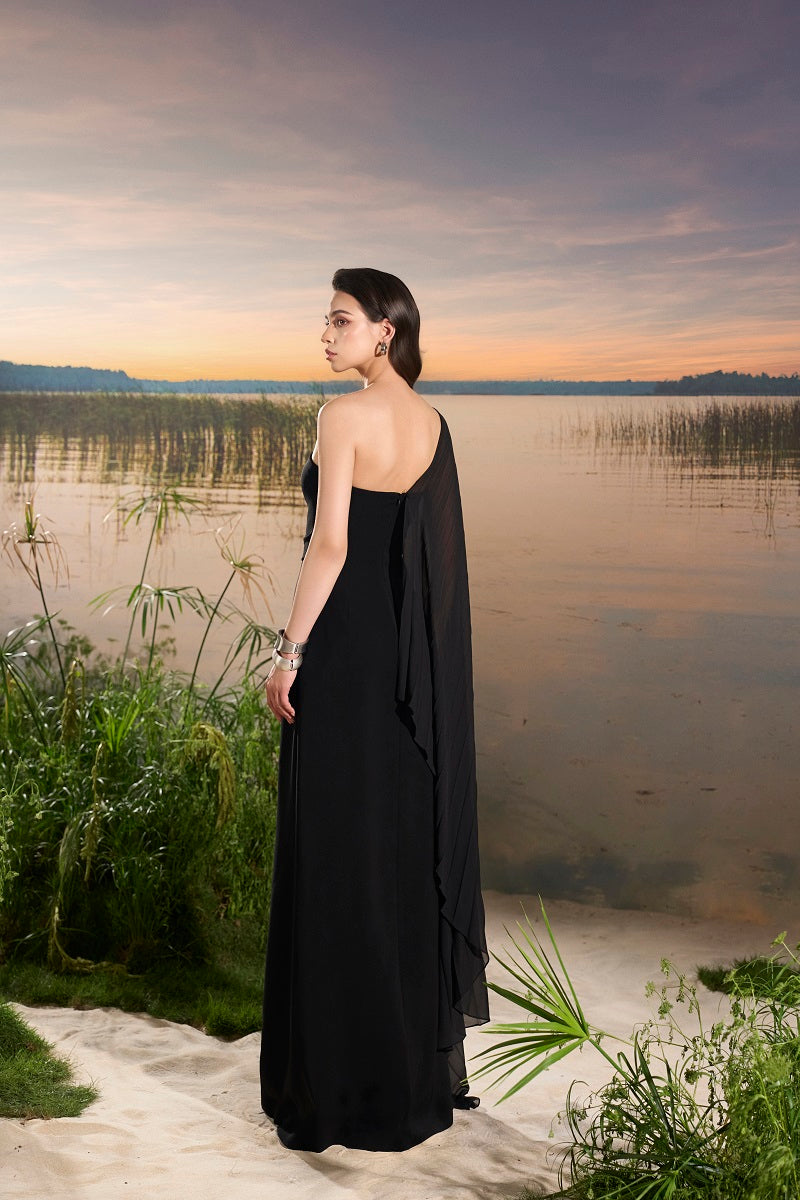 Velvet satin asymmetric cape sleeve maxi dress by Tracy Studio showcasing a flowing design and elegant silhouette.