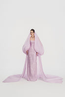 Elegant jacquard gown with a hooded veil cape by Tracy Studio, featuring intricate patterns and luxurious fabric details.