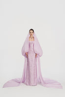 Elegant Jacquard gown with hooded veil cape by Tracy Studio, featuring intricate patterns and flowing fabric.