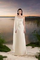 Elegant chiffon asymmetric cape sleeve gown by Tracy Studio, showcasing flowing fabric and stylish cape detail.