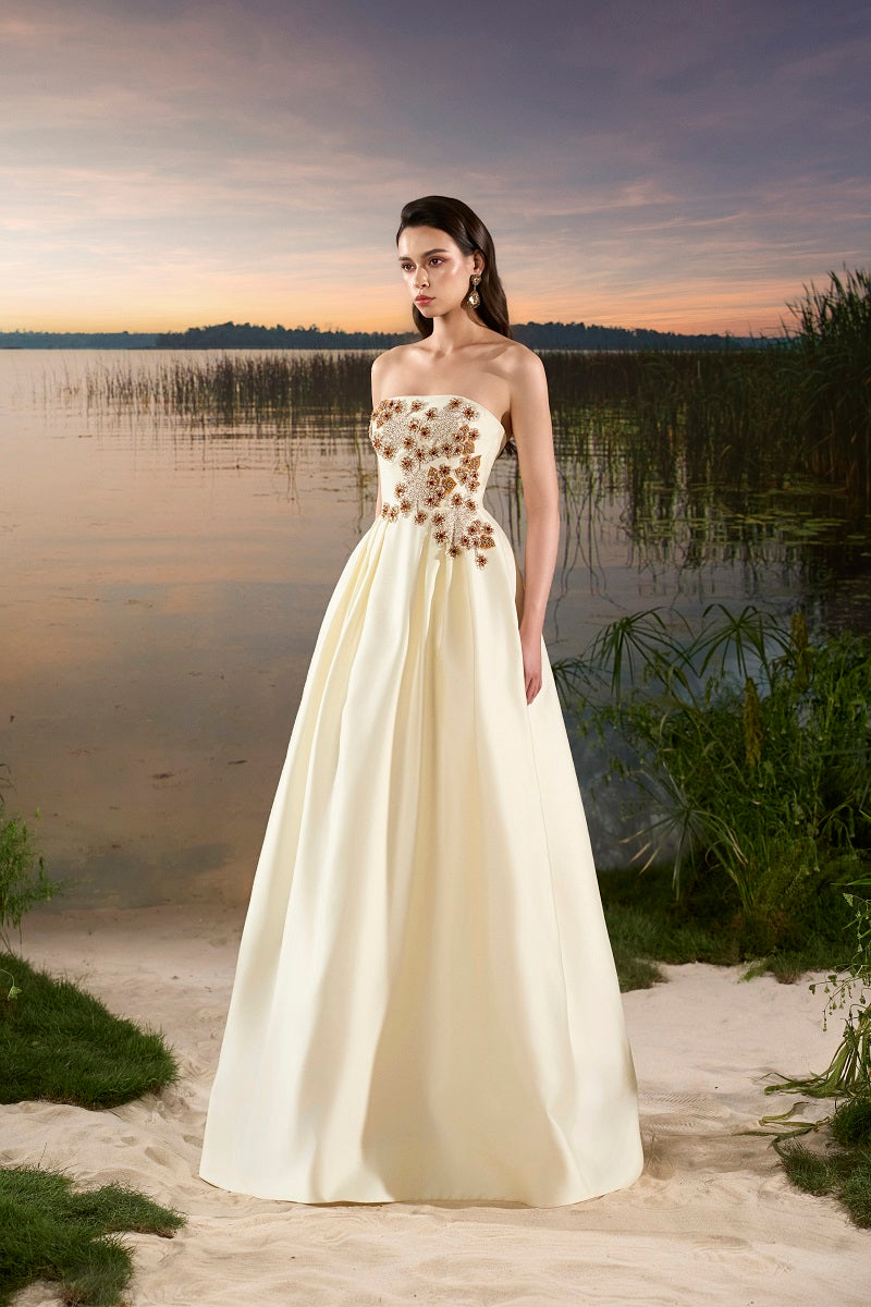 Elegant taffeta mermaid gown with puffy cape by Tracy Studio, featuring fitted silhouette and flowing design for formal occasions.