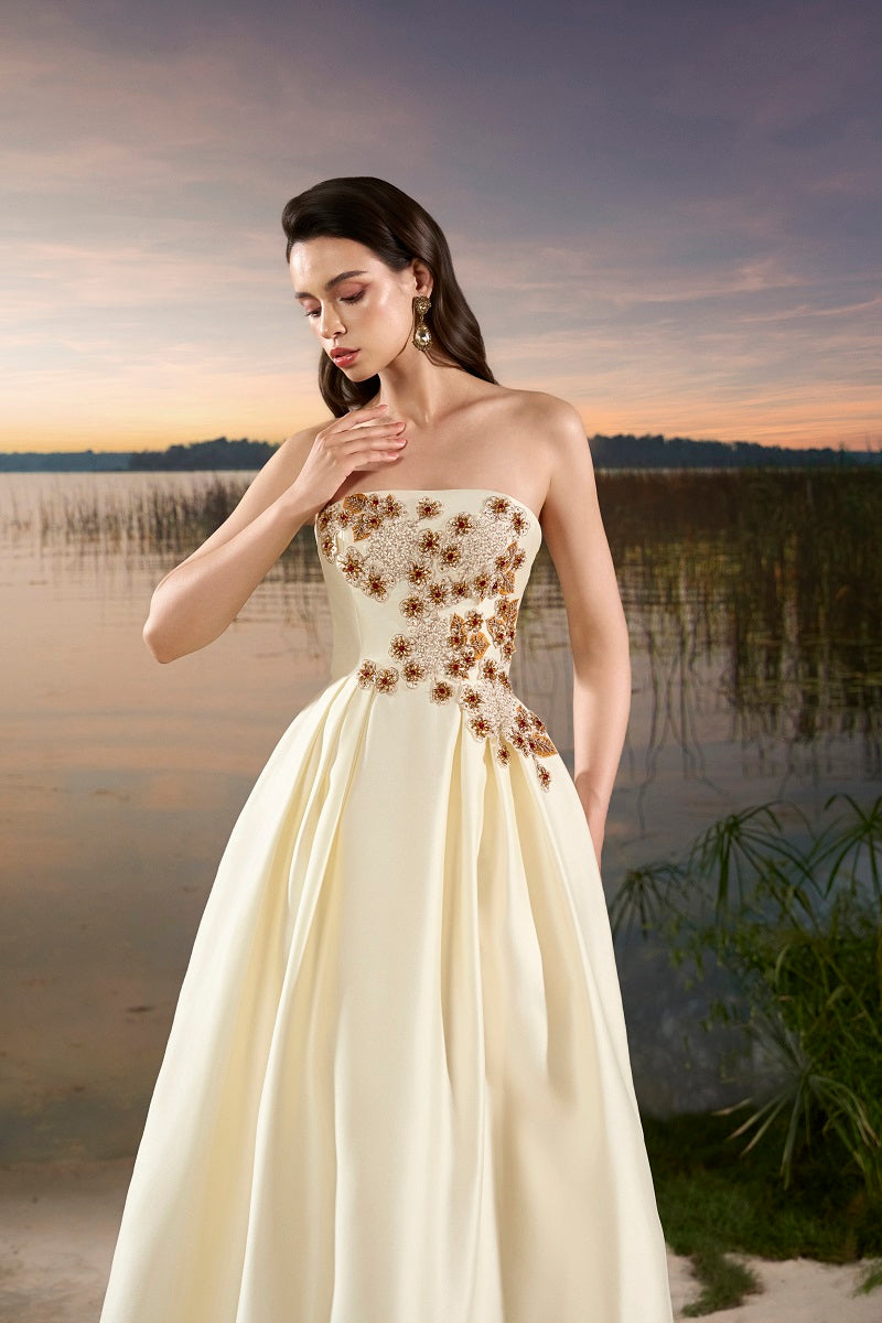 Elegant taffeta mermaid gown with a puffy cape by Tracy Studio, featuring a fitted silhouette and flowing design.